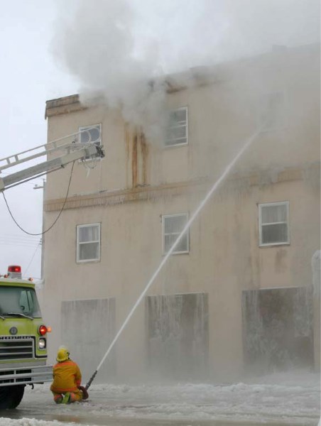 Firefighters work on extinguishing the blaze at the Bonnyville Hotel fire on Dec. 16.