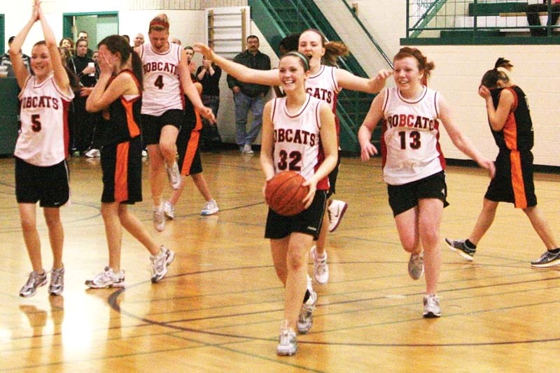 As the final buzzer sounds, the Dr. Brosseau Bobcats celebrate, having just won the district championship. The tournament was hosted by Dr. Brosseau and H.E. Bourgoin School