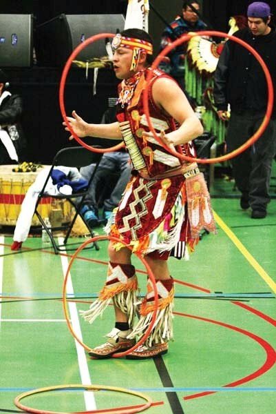Dallas Arcan performs hoop dancing for the crowd at the youth conference.