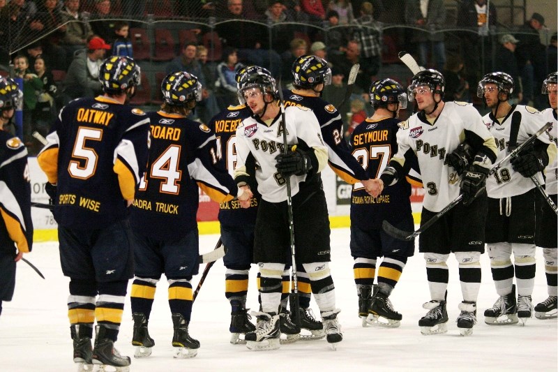 The Pontiacs, led by assistant captain Devon Kalinski shake hands with the victorious Fort McMurray Oil Barons, following Monday&#8217;s game six loss.