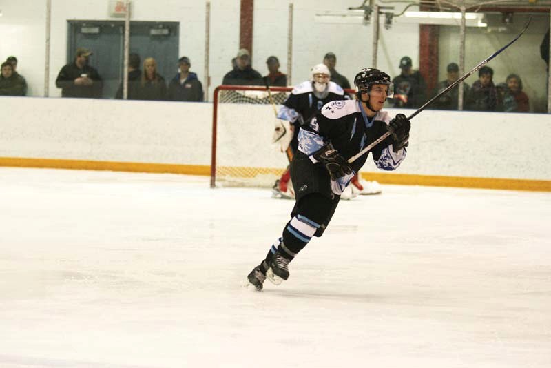 Cold Lake Ice defenceman and Bonnyville Jr. A Pontiacs affiliate Beau Ferbey goes in for the hit during game one of the league finals. The Ice beat Lloydminster March 19 to