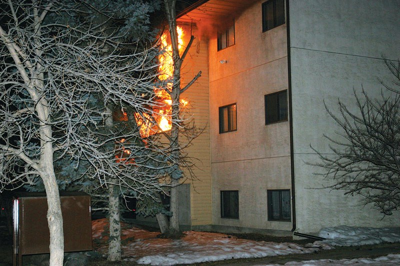 Flames engulf a second floor balcony before the arrival of the Bonnyville Regional Fire Authority on April 4.