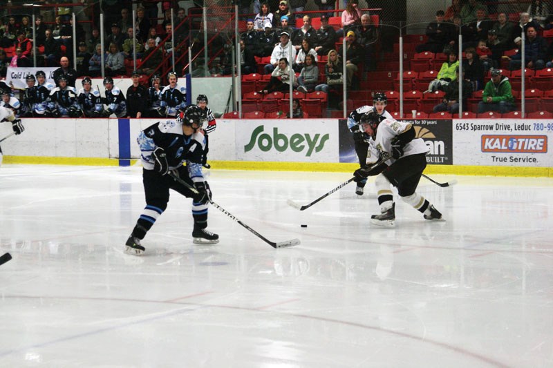 Cold Lake Ice forward Matt Laboucane threads a pass to linemate Dallas Ansell cutting to the slot.