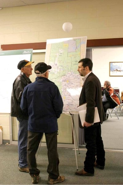 Jason Cathcart greets members of the public at the Lower Athabasca Regional Plan information session on April 18 in Bonnyville.