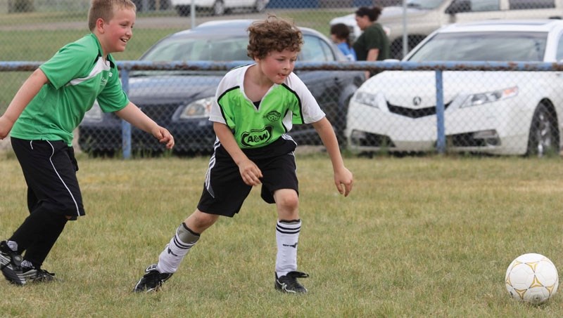 A player from Bonnyville Team D, the Spartans, goes for the ball with a opponent on his tail during one of the matches at Saturday&#8217;s soccer tournament.