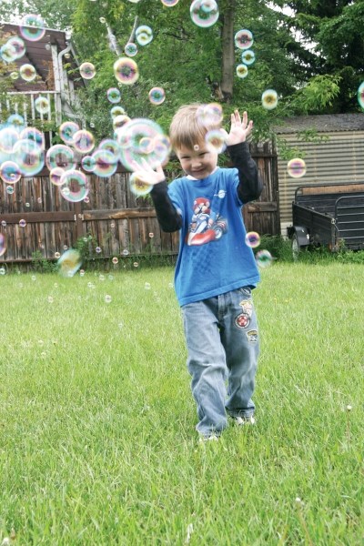 The writer&#8217;s nephew, Aiden Barr, plays with bubbles before his birthday party June 18.