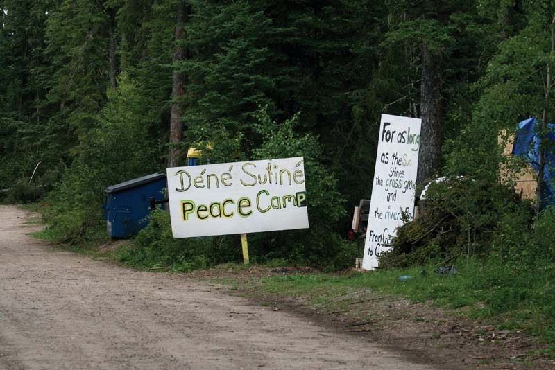 Signs denote the camp set up by Dene Suline and Cold Lake First Nations protesters at the English Bay campground, where the Alberta government has proposed re-development of