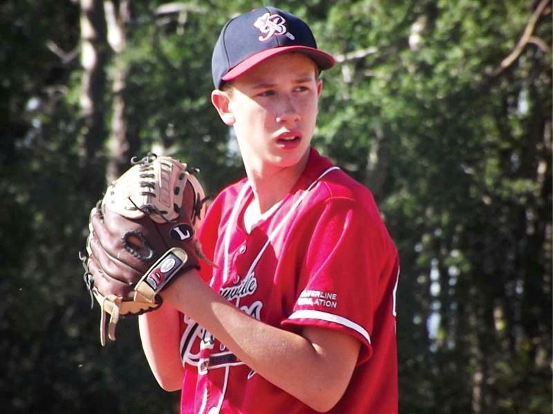 Bonnyville Braves peewee pitcher Colin Nazarchuk looks into the catcher for the sign before making the pitch during a game in Westerdale earlier this month.