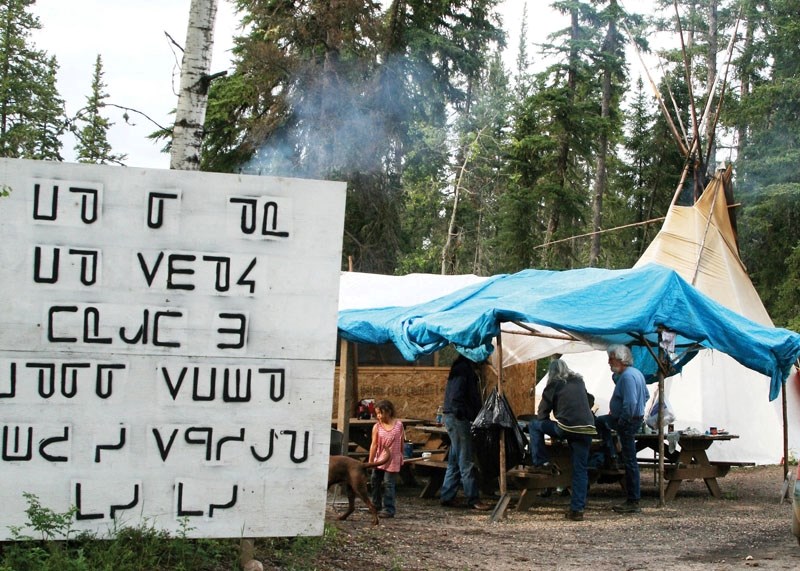 A judge has allowed three protesters, two teepees and a sacred fire to remain at the Déné Suliné Peace Camp at the entrance to the English Bay campground until the judicial