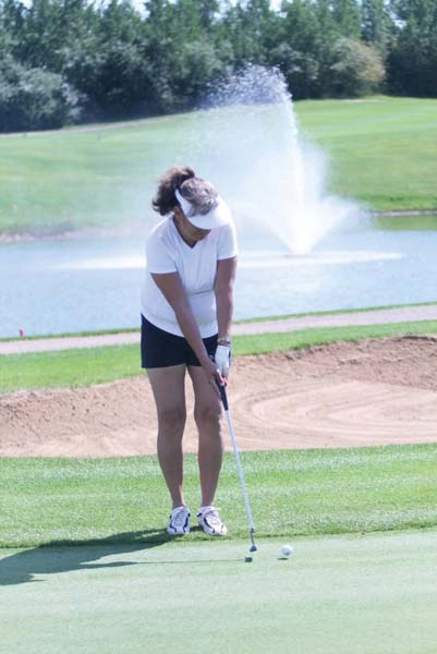 Angie Large sends her ball towards the hole on the 18th green at the Bonnyville Golf and Country Club this past Saturday. Nearly 100 golfers participated in the Ladies Open
