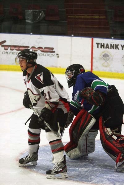 Pontiacs forward Dante Borrelli screens the Portage College goalie during an exhibition game this past Saturday in Bonnyville. The Pontiacs lost 6-3. The two teams tied 2-2