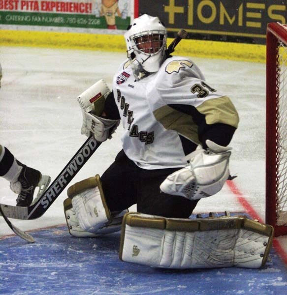 Pontiacs goalie Dylan Wells makes one of his many saves in the third period of Saturday&#8217;s home opener at the R.J. Lalonde Arena.