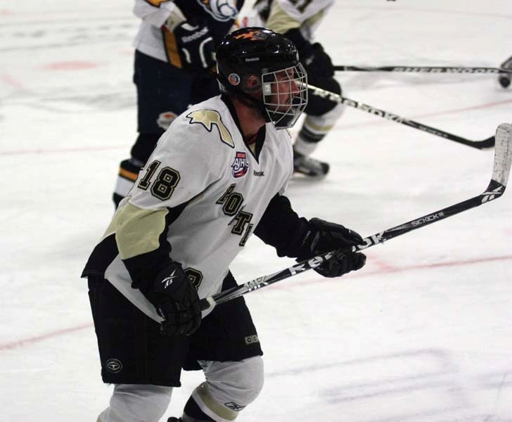 Pontiacs forward Tommy Barszcz circles in the offensive zone looking for a pass during Sunday afternoon&#8217;s game against the Mustangs. Barszcz netted the first hat-trick
