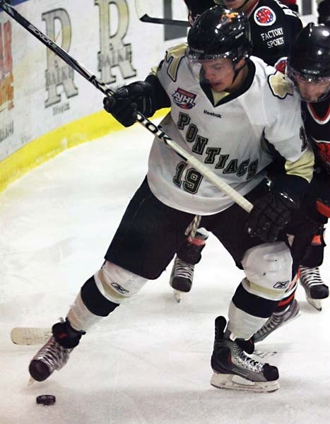 Max Collins fights off a check against Lloyd earlier this month. Collins has brought a physical element to the Pontiacs this season.