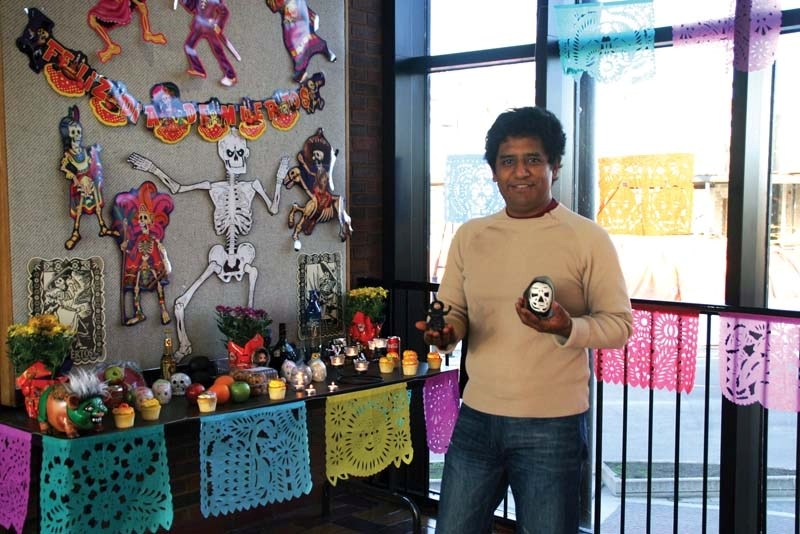 Arturo Romero shows off the altar he and his students created to honour the spirits of the dead as part of the Spanish language class he teaches.