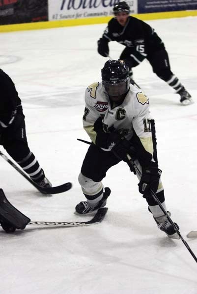 Pontiacs co-captain Kevin Carthy battles for the puck in front of the net in a game against Sherwood Park earlier this season. The Pontiacs won two of three games this past