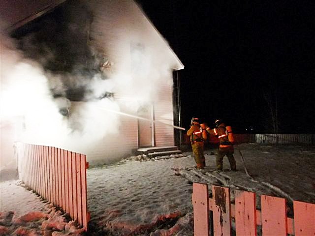 Firefighters from Ardmore, Fort Kent, and Bonnyville work to put out a fire at a house 2.5 kilometres from Bonnyville early Tuesday morning.