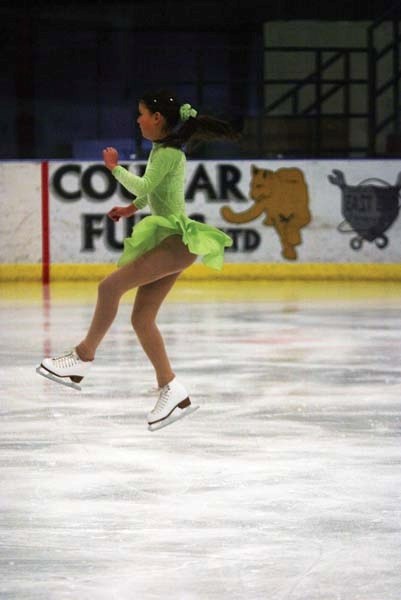 Emily Russ, from St. Paul, competes in the fourth flight of the pre-preliminary freeskate event.