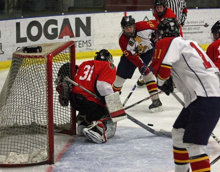 Midget AA Northeast Panthers forward Steenn Pasichnuk saucers a pass to linemate and the league&#8217;s leading scorer Mark Dubeau during a game in January. Pasichnuk had a