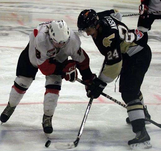 Bonnyville Jr. A Pontiac Levi Ansell battles a Camrose Kodiak for the puck in the offensive zone of the third period during Saturday&#8217;s game at the R.J. Lalonde Arena.