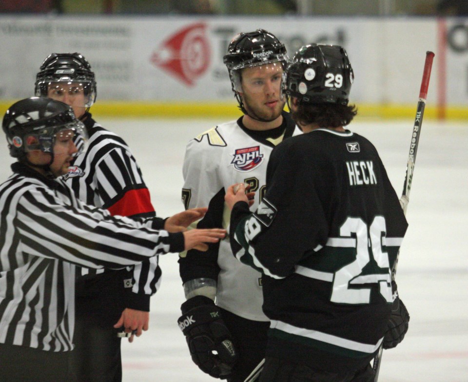 Pontiacs defenceman Chris Lijdsman has a few words with Sherwood Park Crusaders forward JC Heck during a game in Bonnyville earlier this season. The Pontiacs and Crusaders