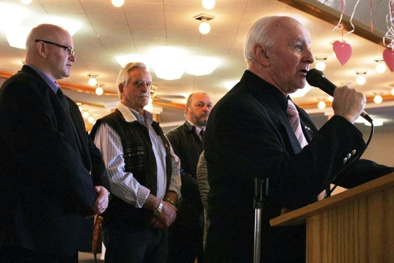 Town coun. and chairman of the Lakeland Lodge and Housing Foundation Ray Prevost (right) introduces Ministers Doug Griffiths and George VanderBurg at the announcement for a