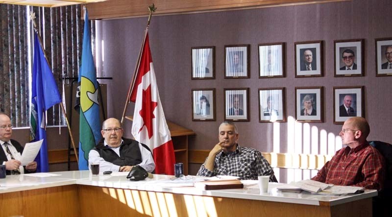 Enbridge representatives Ferlin Koma (centre right) and Allen Sawatzky (far right) present information regarding the company&#8217;s proposed Athabasca Pipeline Twinning