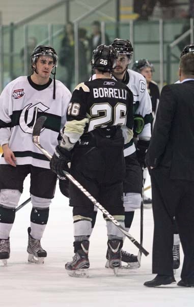 Bonnyville Jr. A Pontiacs co-captain Dante Borrelli is met by Sherwood Park Crusaders captain Jesse Hilton as the two teams shook hands following the Crusaders game 5 win in