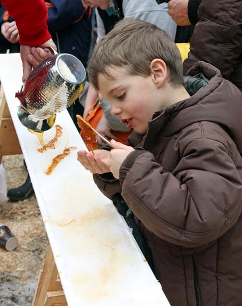 Six-year-old Ben Sylvestre gets himself into a sticky situation as his maple toffee slowly slides from his stick into his hand, though he doesn&#8217;t seem to mind.