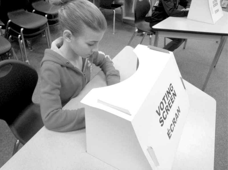 H.E. Bourgoin Grade 5 student Lauren Metcalfe casts her vote.