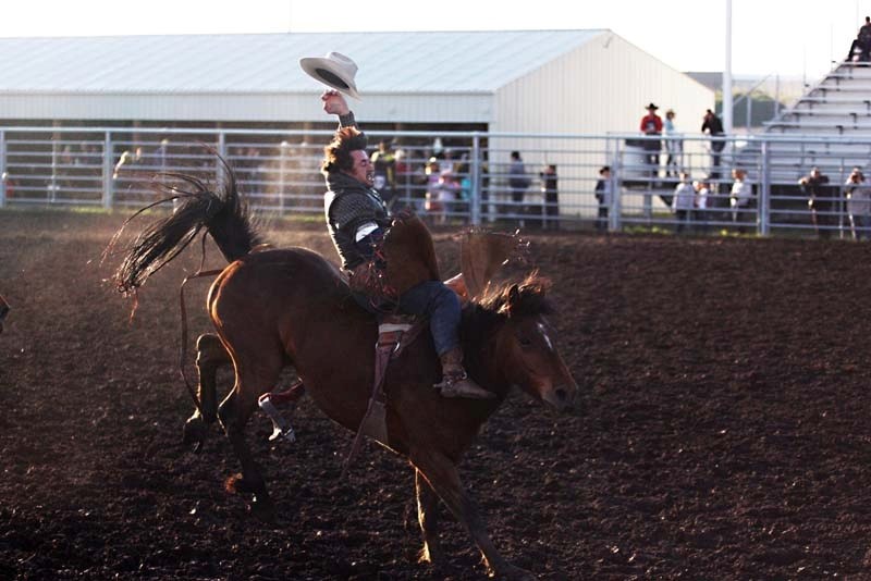 A cowboy loses his hat but not his grip on Friday night at the Bonnyville Pro Rodeo. The rodeo ran all weekend long, with nearly 2,600 spectators in attendance.