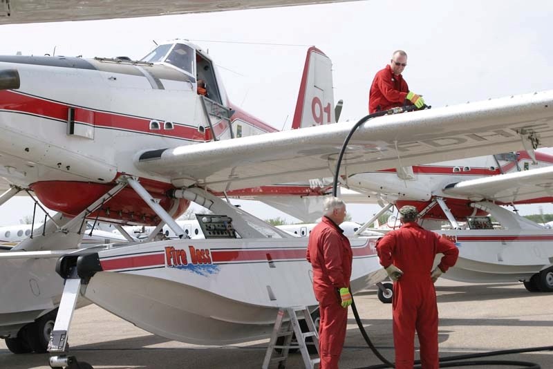 Firefighters gas up their waterbombers at the Bonnyville airport. Town and MD council are considering various upgrade projects to the airport.