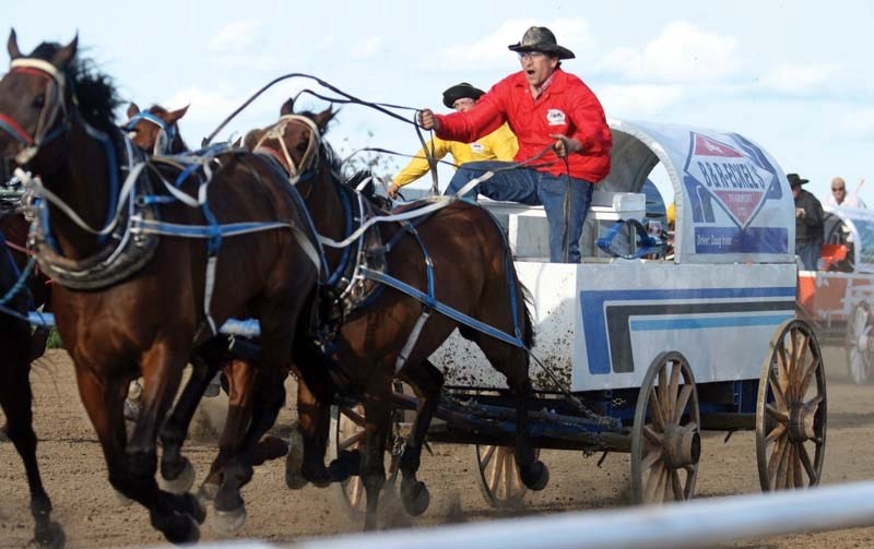 Local chuckwagon driver Doug Irvine thunders towards the finish line at the Bonnyville chuckwagons.