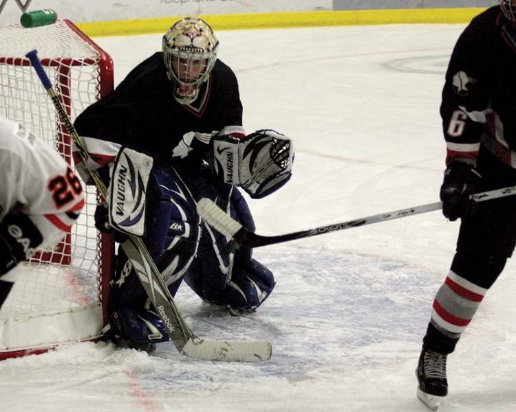 A goalie for the Bonnyville Jr. A Pontiacs keeps his eye on the puck during the Pontiac&#8217;s first home exhibition game of the 2012/2013 season on Aug 24.