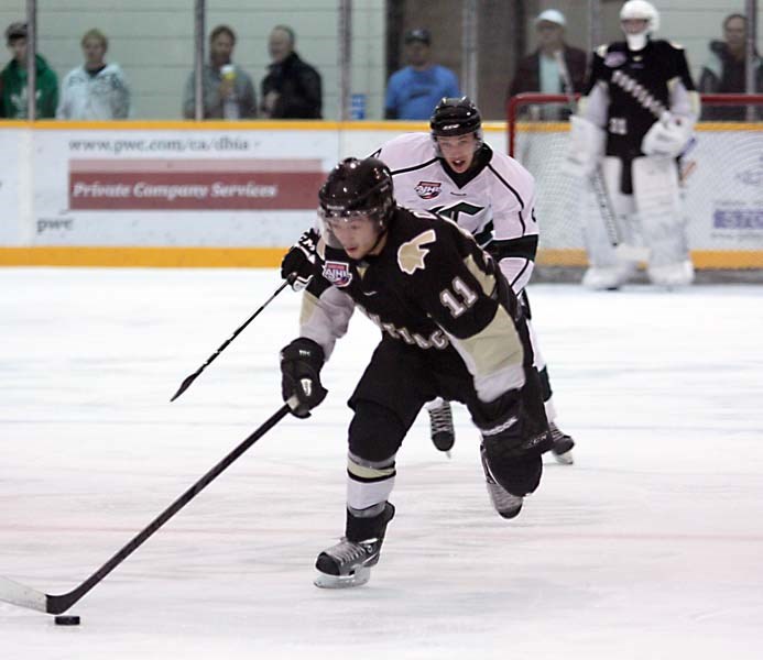 Bonnyville Jr. A Pontiacs forward Jackson Dudley breaks away from the defence and scores one of his two goals on the night, during the Pontiacs 4-3 defeat of the Crusaders in 