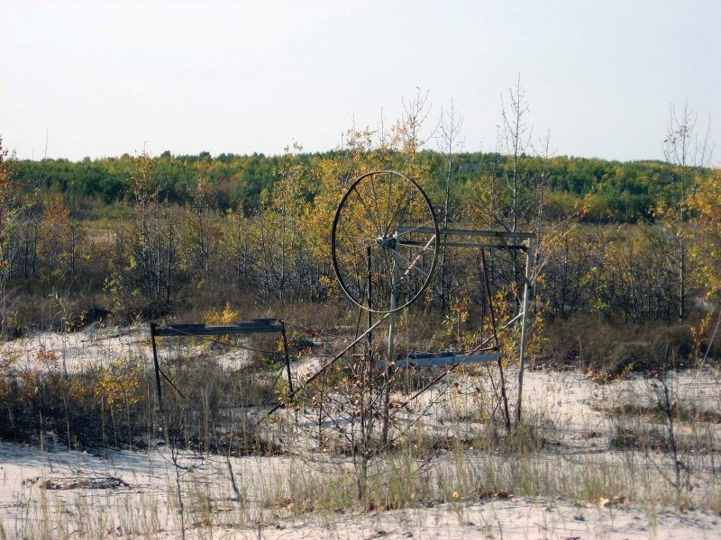 Due to the receeding water level, trees and shrubs have grown over this old boat lift at Muriel Lake. Corey Neufeld, Muriel Lake Bason Management Society member, has had