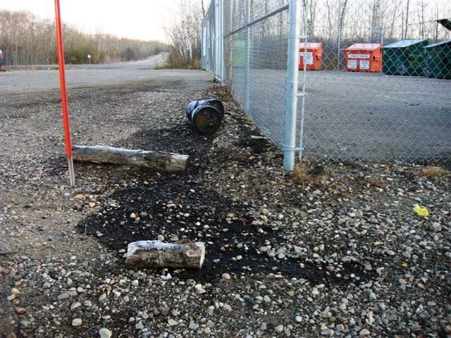 Liquids spilled from containers not properly disposed of last fall leech into the ground near the property of MD residents Mike and Agnes Wasylyk.