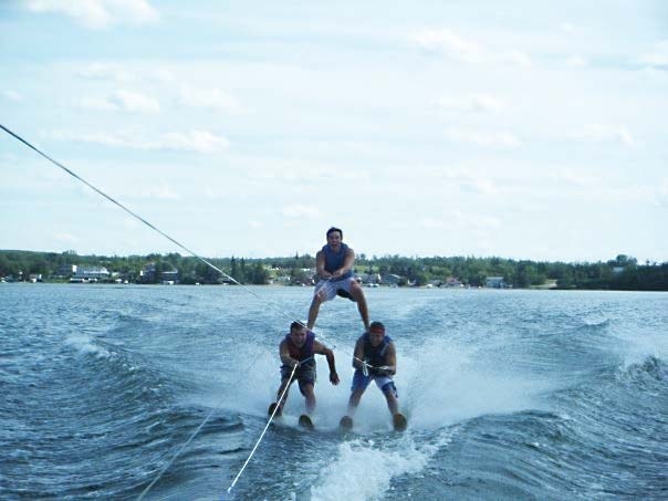 Friends from Bonnyville, Neil Langridge, Joel Bourget and Brian Krawchuk sort out the subtle intricacies of the self-taught waterski pyramid last summer on Moose Lake.