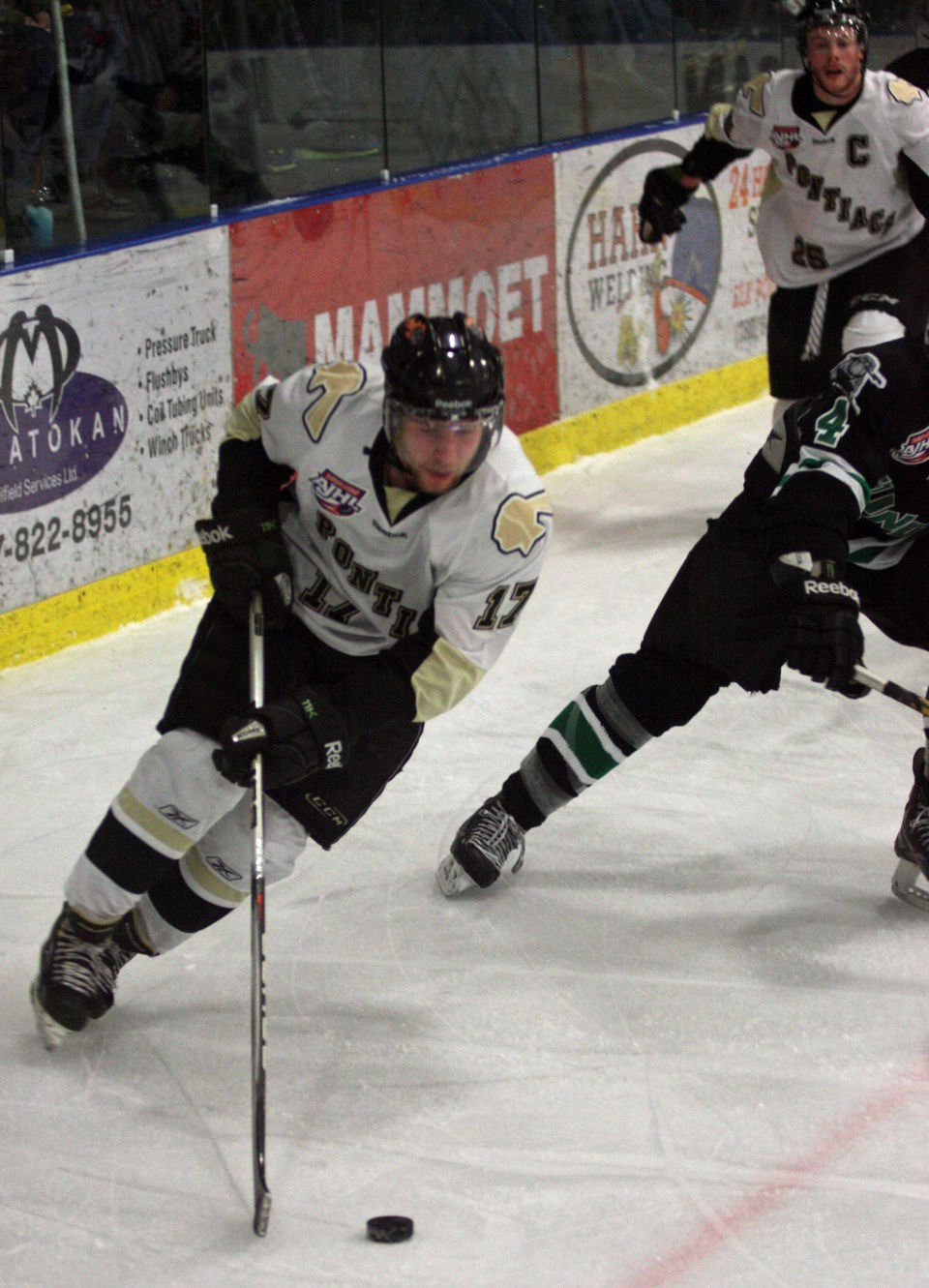 Pontiacs forward Connor Garden cuts out from the corner and takes the puck to the net during the first period of game two in Bonnyville Wednesday against Drayton Valley.