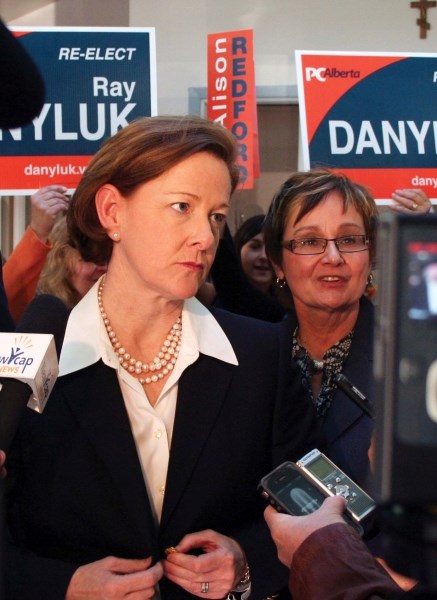 Premier Alison Redford, along with MLA for Bonnyville-Cold Lake Genia Leskiw answers questions from the media during a campaign stop in St. Paul in April last year.