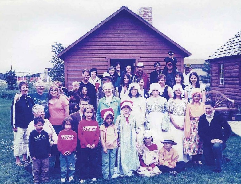 Four generations of Croteaus gather for a photo in front of the first framed building in the Bonnyville area, which is now located at the Bonnyville Museum and turned 105