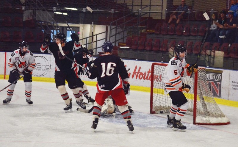 The Pontiacs celebrate on Alex Smith&#8217;s goal in the first period against Lloydminster on Tuesday night. The Pontiacs went on to win 3-2 in overtime.