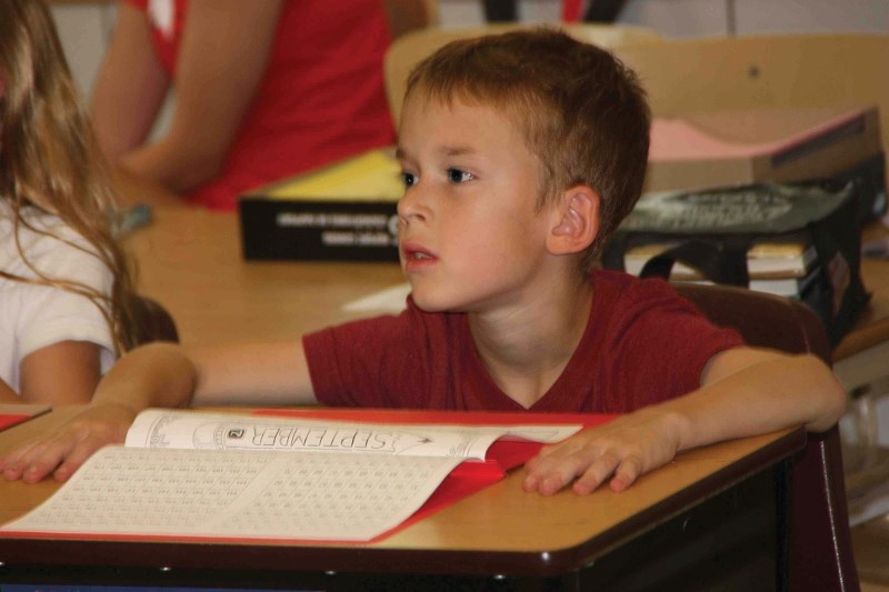 Dylan Dumais, a Grade 3 student at Duclos School listening to his teacher as he, along with every other student in the region, enjoyed their first full week back at school.