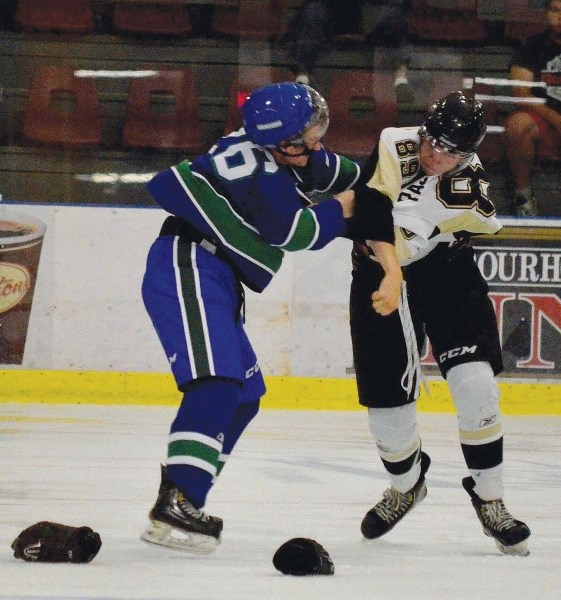 Bonnyville native Steen Pasichnuk and Calgary&#8217;s William Nicholas fight during the second period on Sunday afternoon at the RJ Lalonde Arena. The Pontiacs routed the