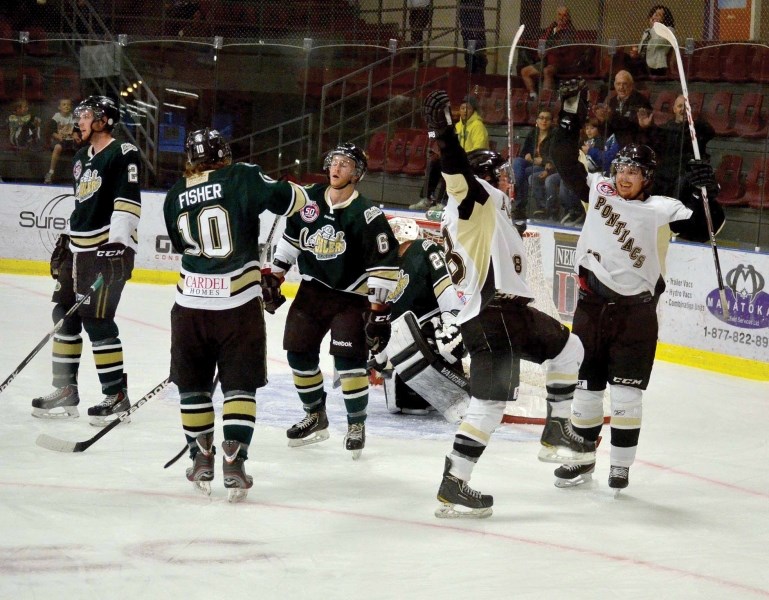 Tommy Baszcz and Brady Bakke celebrate Barszcz&#8217;s first period goal in Saturday night&#8217;s game versus Okotoks. The goal proved to be the winner, as Pontiacs goalie