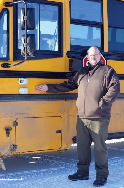 Matt Richter, director of transporation for the Northern Lights School division shows off two cameras that have been installed on the outside of one of their buses. The