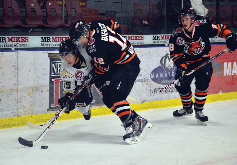 Pontiacs forward Spencer Foo battles Lloydminster&#8217;s Lukas Biensch during AJHL action on Dec. 10 at the RJ Lalonde Arena. Bonnyville got beat 6-3 and lost star forward