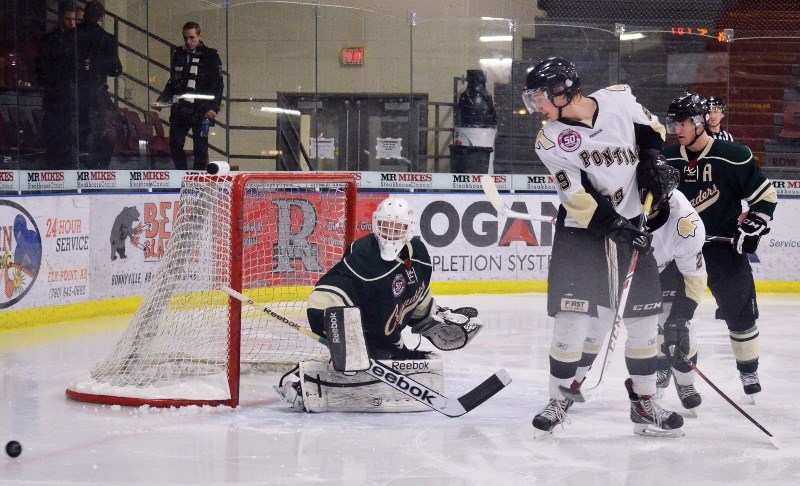 Pontiacs forward Steenn Pasichnuk tips a puck on goal during AJHL action on Dec. 18 at the RJ Lalonde Arena. The visting Sherwood Park Crusaders beat the Pontiacs 6-2.