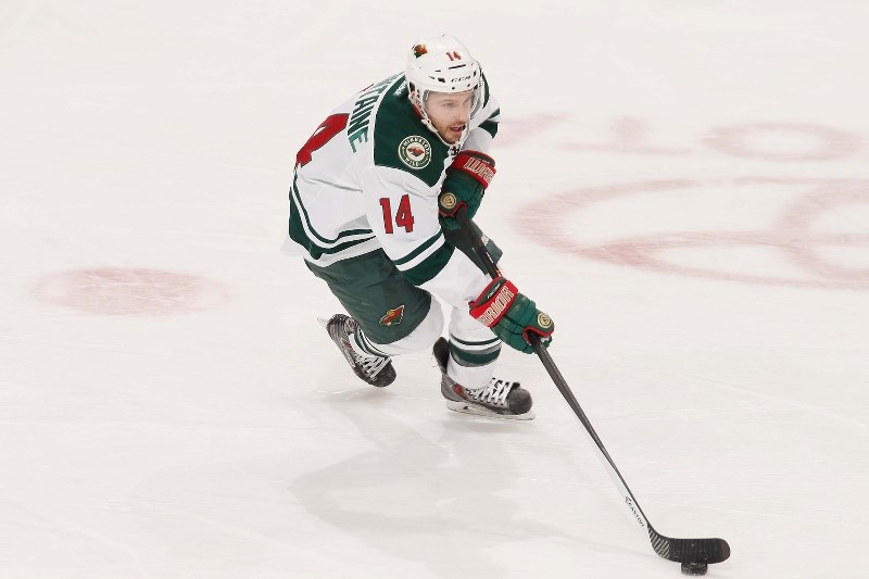 Justin Fontaine of the Minnesota Wild skates with the puck during the game against the Nashville Predators on Feb. 6, at the Xcel Energy Center in St. Paul, Minnesota.