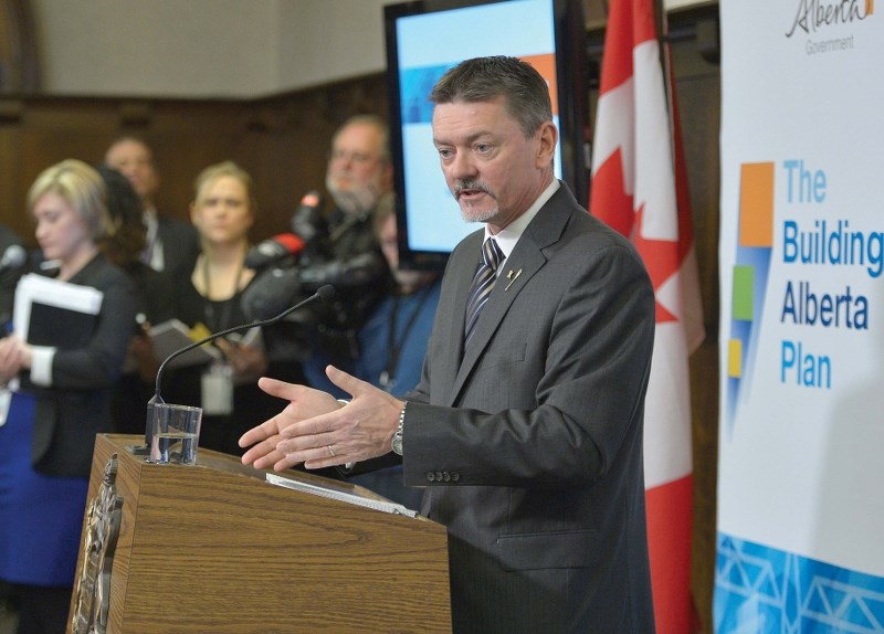 Minister of Finance Doug Horner answers reporters&#8217; questions at a news conference in Edmonton, March 6, prior to presenting Alberta&#8217;s 2014 provincial budget in